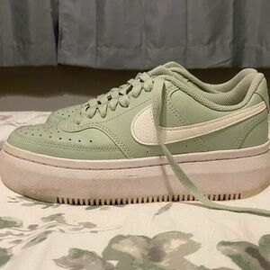 Nike Green and White Sneakers with Retro Style